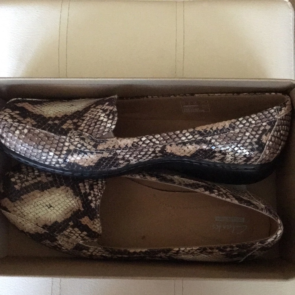 Clark’s snake print moc toe loafers